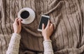 Girl home clothes smartphone cup coffee bed Royalty Free Stock Photo