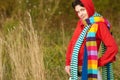 Girl in hood with multi-colored scarfs Royalty Free Stock Photo