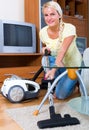 Girl hoovering in living room Royalty Free Stock Photo