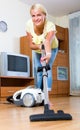 Girl hoovering in living room Royalty Free Stock Photo