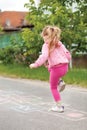 Girl on the hopscotch Royalty Free Stock Photo