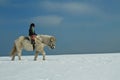 Girl Horse riding in the snow