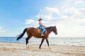 Girl with horse on seacoast Royalty Free Stock Photo