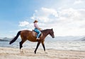 Girl with horse on seacoast Royalty Free Stock Photo