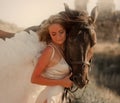 A girl on a horse with white angel wings at a horse Royalty Free Stock Photo