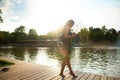 girl with hot on the summer pier