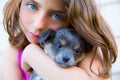 Girl hug a little puppy dog gray hairy chihuahua Royalty Free Stock Photo