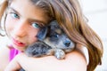 Girl hug a little puppy dog gray hairy chihuahua Royalty Free Stock Photo