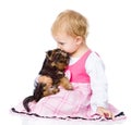 Girl hug a little Yorkshire Terrier puppy. isolated on white
