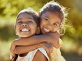 Girl, hug and love, sisters and happy in portrait together, young kids outdoor and family bonding in nature. Indian Royalty Free Stock Photo