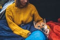 Girl hug resting dog together in campsite, close up portrait red shiba inu sleeping in camp tent , hiker woman leisure with puppy Royalty Free Stock Photo