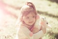 Girl hug soft horse toy on sunny day Royalty Free Stock Photo