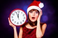 Girl with huge clock and hat Royalty Free Stock Photo