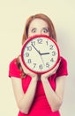 Girl with huge clock Royalty Free Stock Photo