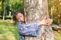 Girl hugging big tree Royalty Free Stock Photo