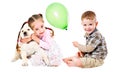 Girl hugging labrador puppy and boy with air balloon Royalty Free Stock Photo