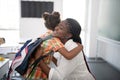 Girl hugging her pleasant teacher while feeling thankful