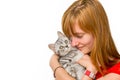 Girl hugging young silver tabby cat Royalty Free Stock Photo