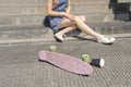 Girl hurt her leg while riding a skateboard Royalty Free Stock Photo