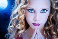 Girl with ice blue eyes at halloween. Royalty Free Stock Photo