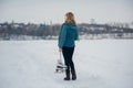 Girl ice skating winter woman holding ice skates outdoors in snow Royalty Free Stock Photo