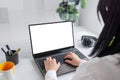 Girl immersed in her tasks on a laptop with an isolated screen for mockup