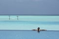 Girl in infinity pool in Maldives Royalty Free Stock Photo