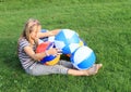 Girl with inflating balls Royalty Free Stock Photo