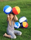 Girl with inflating balls Royalty Free Stock Photo