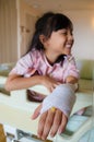 Girl with injured hand Royalty Free Stock Photo