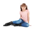 Girl with inline roller skates sitting