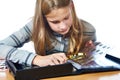 Girl inspecting her collection coins isolated