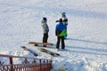 Khabarovsk, Russia - Dec 04, 2016: The girl instructor trains a teenager and a man snowboarding