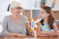 Girl interested in paper windmill