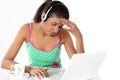 Girl irritating with laptop and headphones Royalty Free Stock Photo