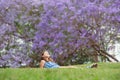 Girl and Jacaranda Tree Royalty Free Stock Photo