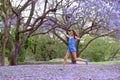 Girl and Jacaranda Tree Royalty Free Stock Photo