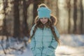 girl in a turquoise jacket and hat Royalty Free Stock Photo