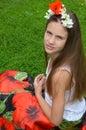 Girl with jasmine flowers and poppies