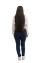 Girl in jeans and a white shirt with long hair. Back view. Full height. Eared on a white background. Vertical