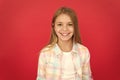 Girl joyful smiling face over red background. Emotional kid happy smiling face. Cheerful adorable girl smiling. Positive