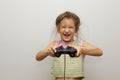 Girl with joystick. Excited little girl playing video game and smiling Royalty Free Stock Photo