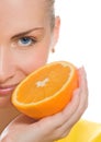 Girl with juicy orange Royalty Free Stock Photo