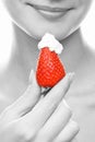 Girl with a juicy strawberry