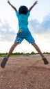 Girl jump on the sky under sunset light Royalty Free Stock Photo