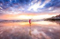 Girl jumping on a beach in Taghazout surf and fishing village,agadir,morocco