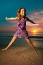 Girl jumping and dancing on beautiful beach. Royalty Free Stock Photo