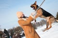 Girl jumping with dog against blue sky Royalty Free Stock Photo