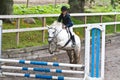 Girl jumping on a horse. Royalty Free Stock Photo