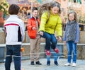 Girl jumping while jump rope game with friends Royalty Free Stock Photo